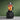 Vitamix VX3 Blender in Black filled with fresh fruit on a green background