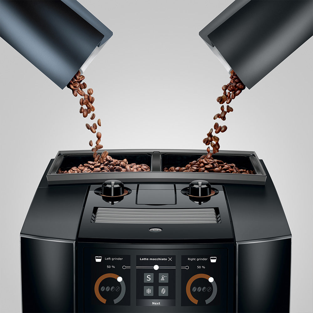 Jura J10 twin in Diamond Black, coffee beans poured into both bean containers