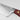 Close-up of the bolster where the blade of a WÜSTHOF CLASSIC knife meets the Tasty Sumac handle