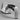 WÜSTHOF CLASSIC IKON 2-Stage Hand-Held Sharpener seen from the handle end, on a grey surface