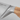 Close-up of the bolster where the blade of the WÜSTHOF AMICI 8" Chef's Knife meets the wooden handle