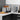 Dualit Design Series 4-slice toaster with toast beside the matching kettle on a grey stone counter