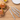 WÜSTHOF GOURMET steak knives in grey on a wooden table beside burgers on a board