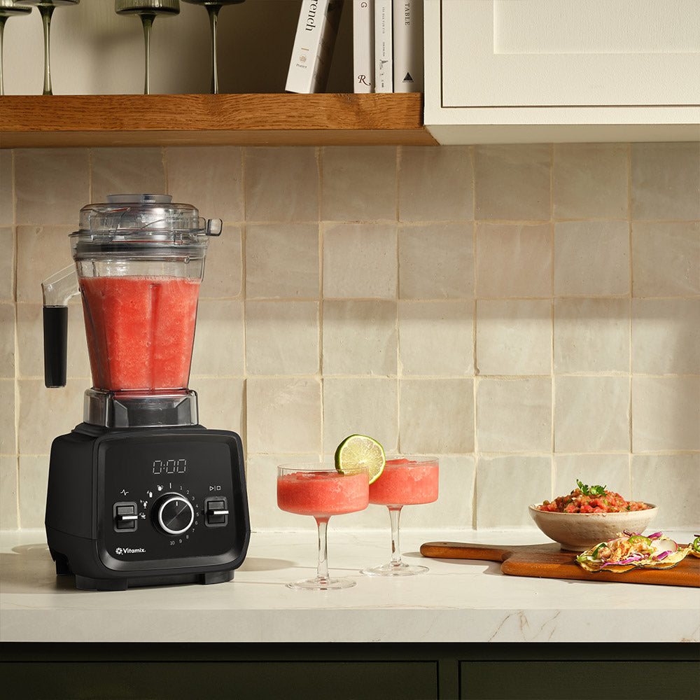 Vitamix VX3 Blender in Black with a red smoothie and cocktails in a kitchen