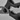 Close-up of the grip teeth between the black handles of WÜSTHOF kitchen shears