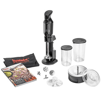 bamix BBQ set laid out on white: black hand blender in its holder, beakers, Processor, attachments, recipe book and apron