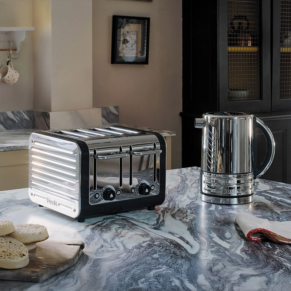 Dualit Design Series 4-slice toaster and kettle on a marble kitchen island with crumpets