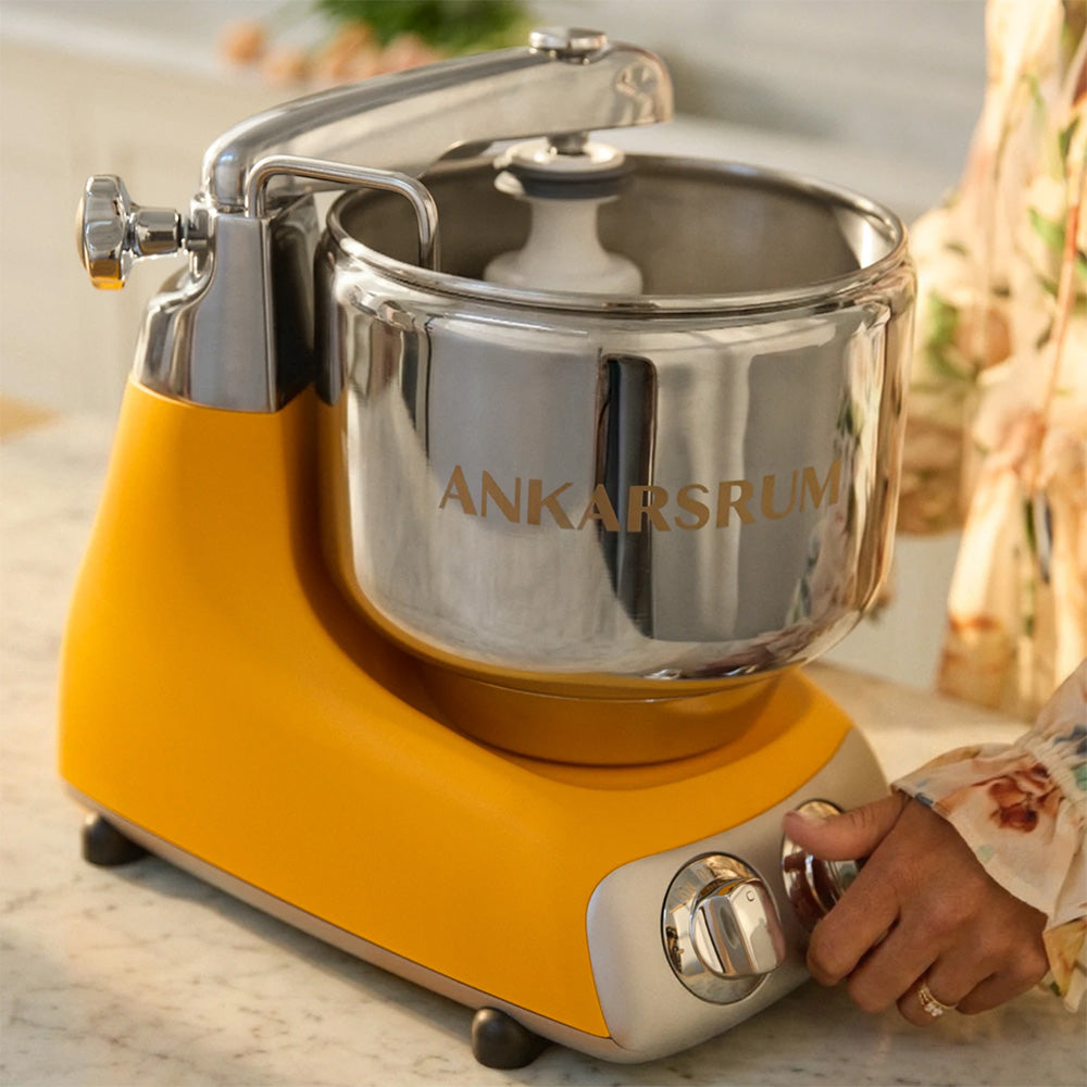 Ankarsrum Assistent Original Stand Mixer Essential Package - Sunbeam Yellow - A stand mixer built around a rotating bowl, not a motor in the head.