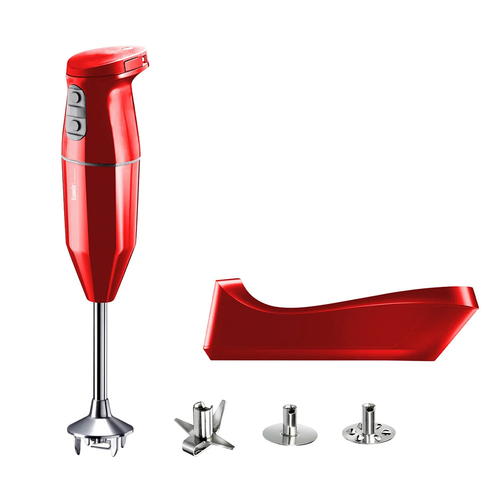 bamix Cordless in red with its charging base and three stainless steel attachments