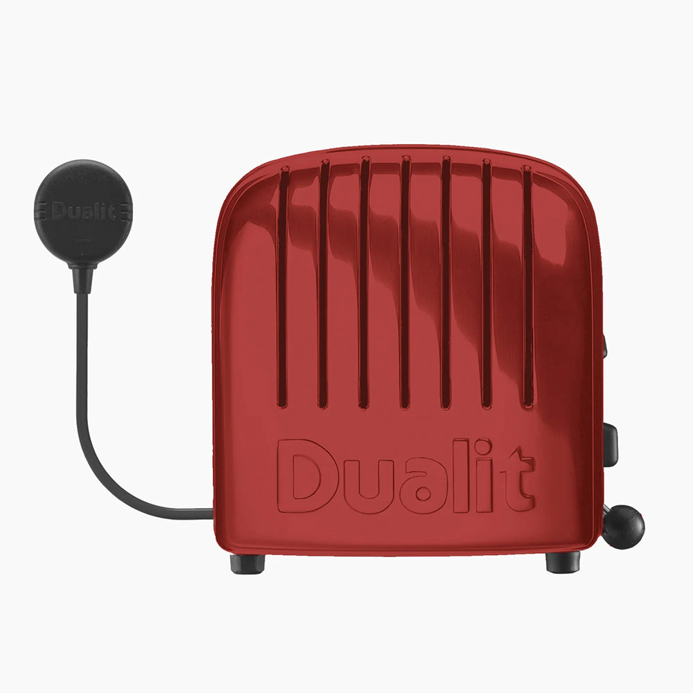 End of a Dualit Classic toaster in red, showing the embossed Dualit name and power cord