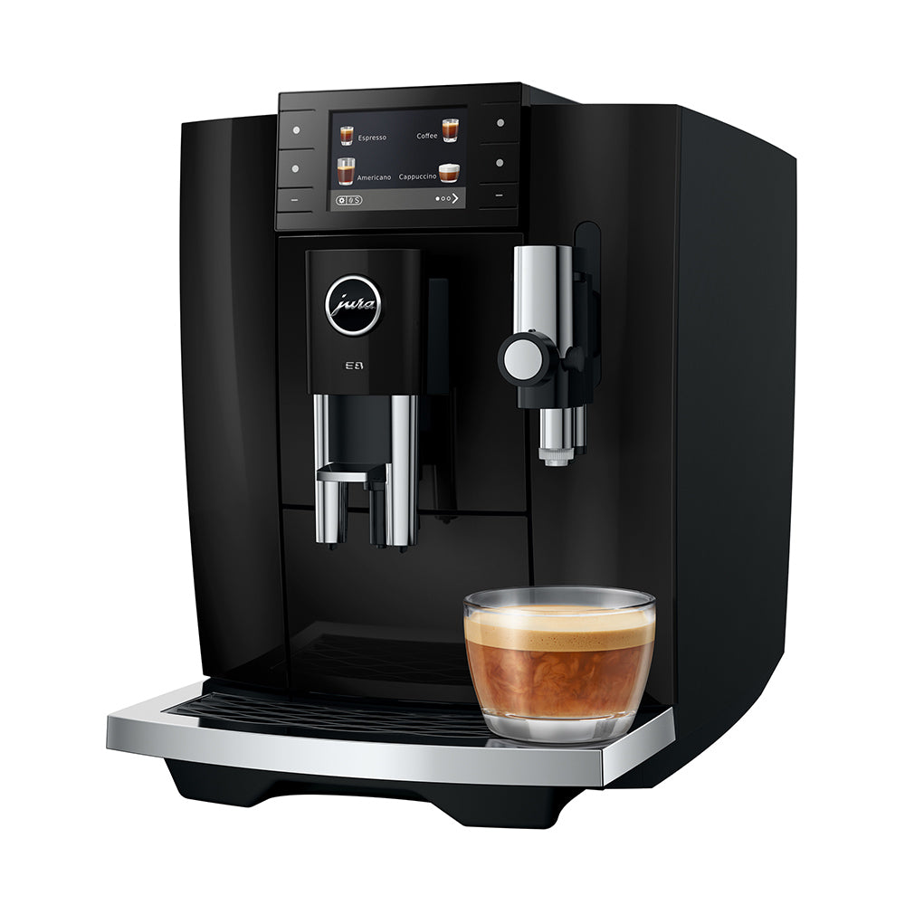 Jura E8 (5th generation) in Piano Black, angled to the left, with a coffee