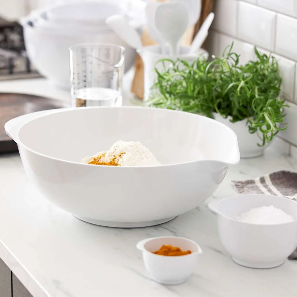 Rosti Margrethe 6L dough bowl in White with flour and spices on a marble counter, beside smaller white bowls