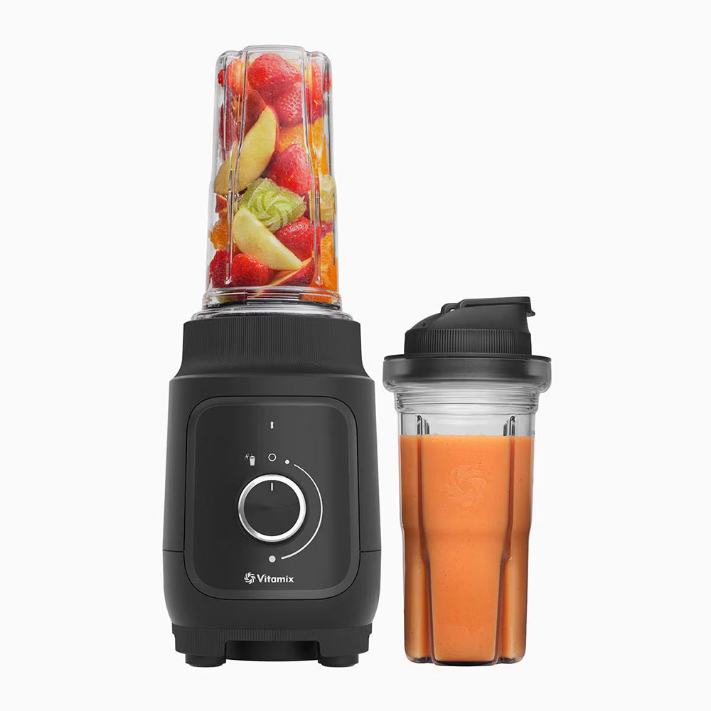 Vitamix Nano Personal Blender in Black with fruit and a smoothie in a to-go cup