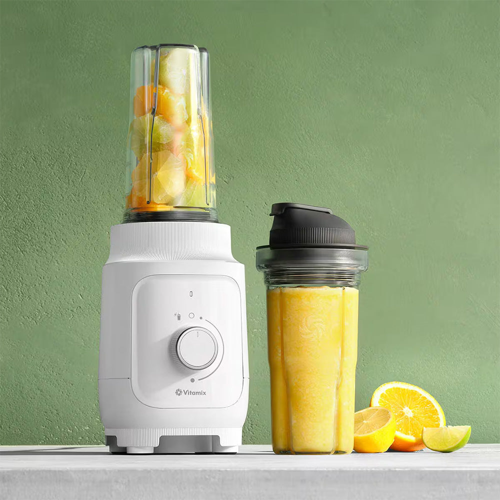Vitamix Nano Personal Blender in White with a yellow smoothie and lemons