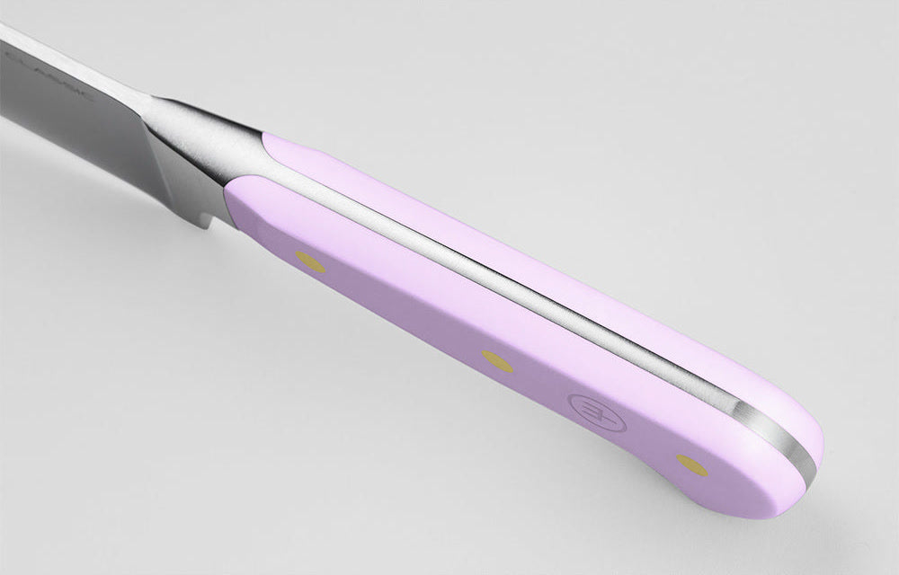 Close-up of the Purple Yam handle of a WÜSTHOF CLASSIC knife from the spine side, showing the tang