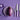 WÜSTHOF CLASSIC knives in Purple Yam on a purple background beside a striped aubergine on a plate