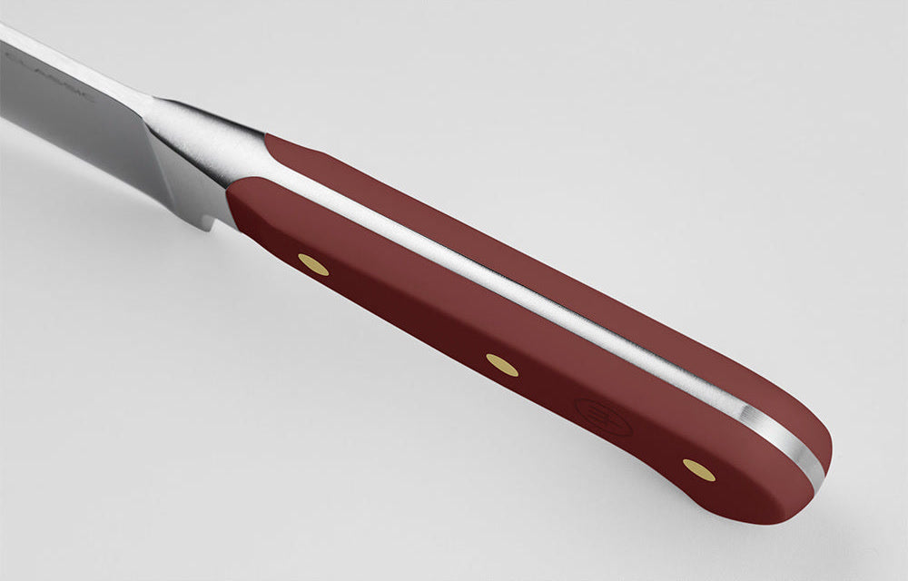 Close-up of the Tasty Sumac handle of a WÜSTHOF CLASSIC knife from the spine side, showing the tang
