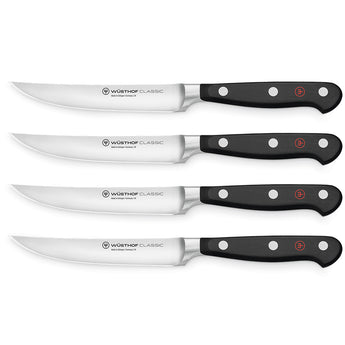 WÜSTHOF CLASSIC 4-Piece Steak Knife Set on a white background
