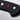 Close-up of the end of the black handle of a WÜSTHOF CLASSIC knife, with its rivets and red trident logo