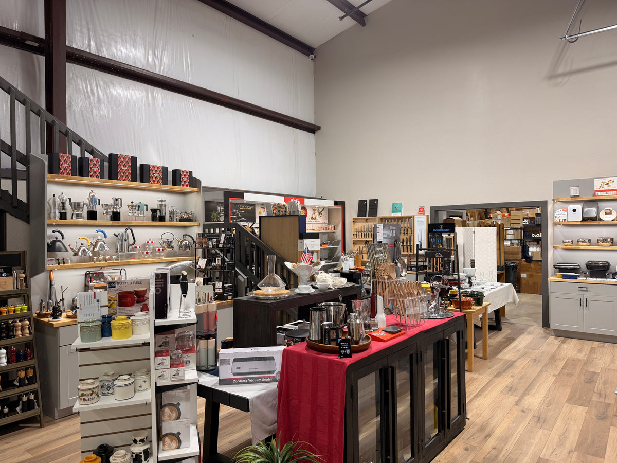 Inside the Design & Grace store in Argyle, Texas, with the staircase and Alessi shelves on the left