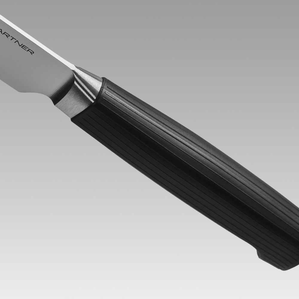 Close-up of the ribbed black handle of a WÜSTHOF PARTNER knife