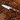 WÜSTHOF AMICI 3.5" Paring Knife on a bed of almonds on a wooden board