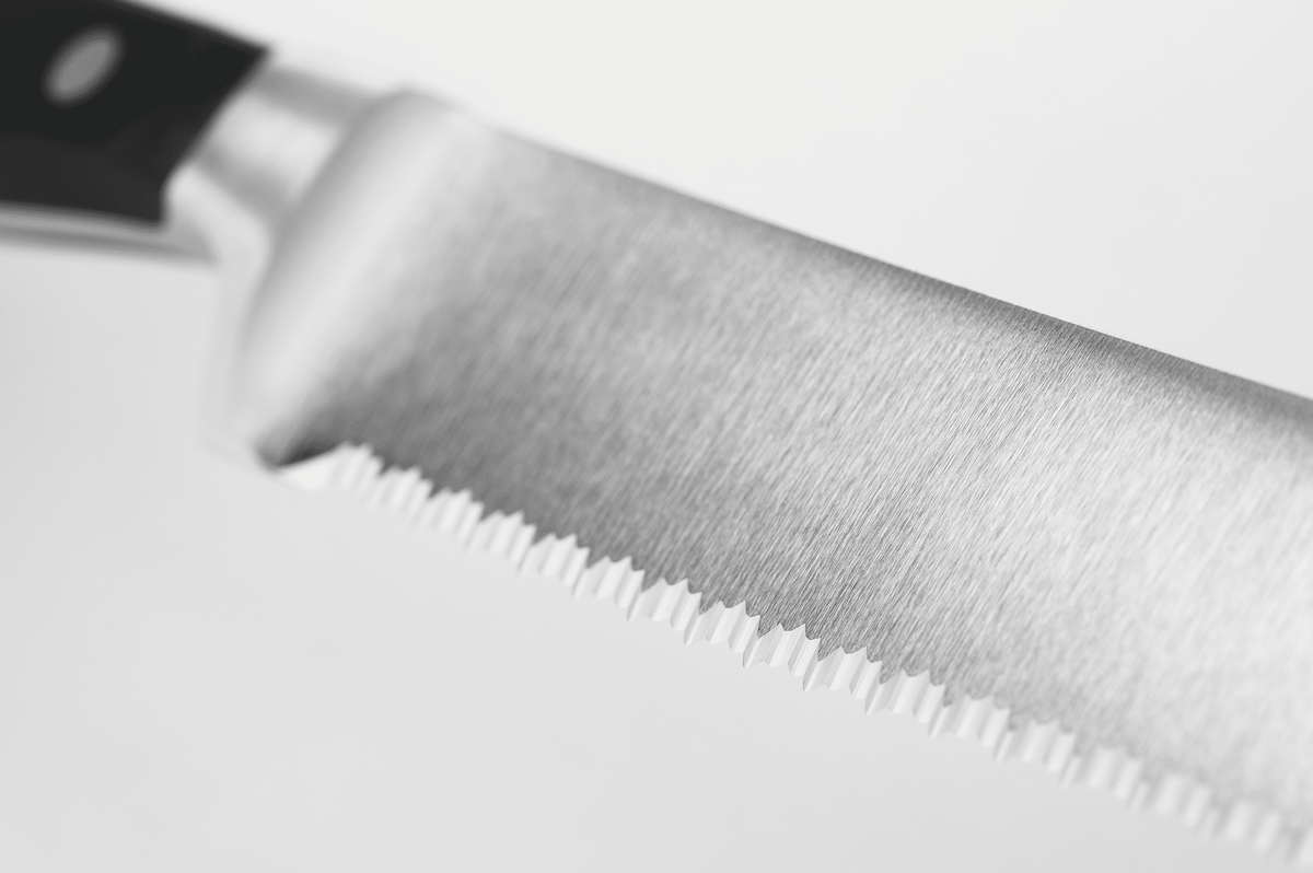 Close-up of the double-serrated edge of a WÜSTHOF CLASSIC knife