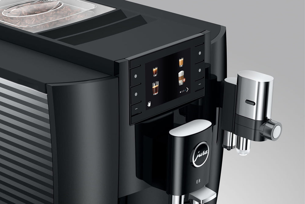 Jura E8 (4th generation) in Piano Black, close-up of the color display, coffee spout and milk spout